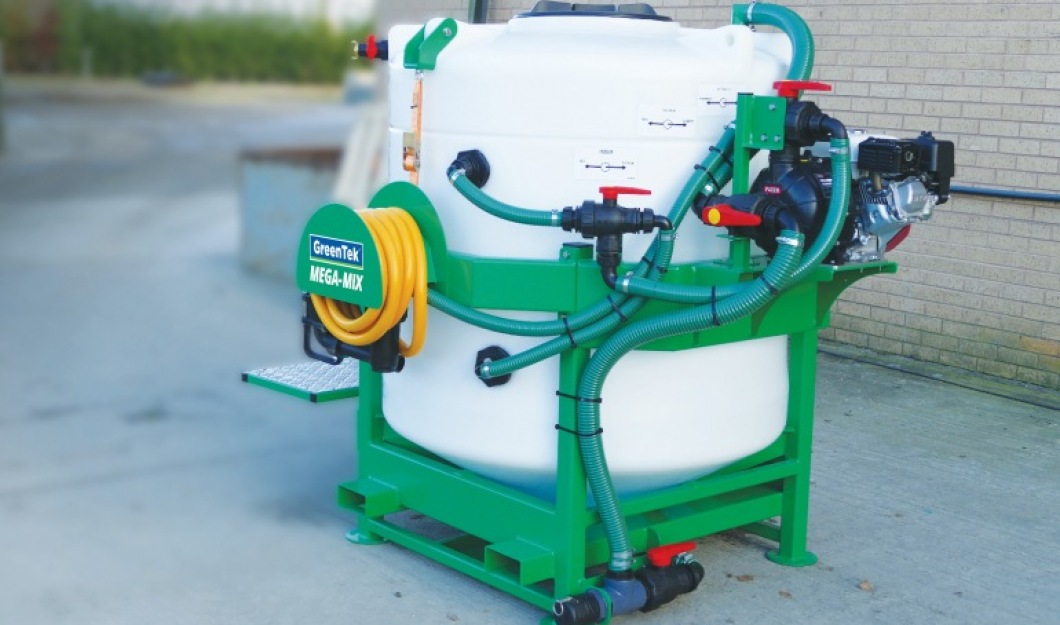 A GreenTek Mega Mix fertiliser mixing tank being used on a sports turf facility to prepare liquid feed.