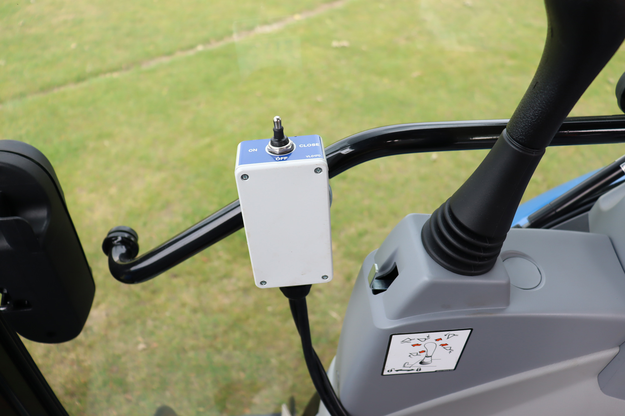 In-cab controls for belt and hydraulic flow gate.