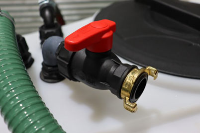 Mains water connection for tank rinsing.
